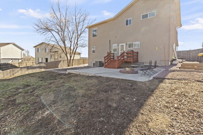 Building Photo - Spacious Home with Finished Basement, Granite Kitchen & Fenced Yard Near Fort Carson