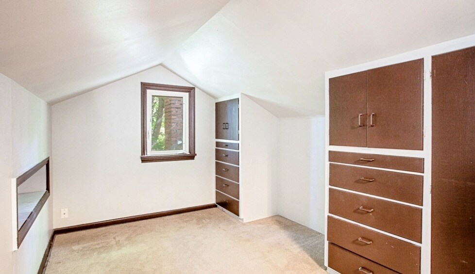 Upstairs bedroom with built in drawers. - 14526 Evanston Ave N