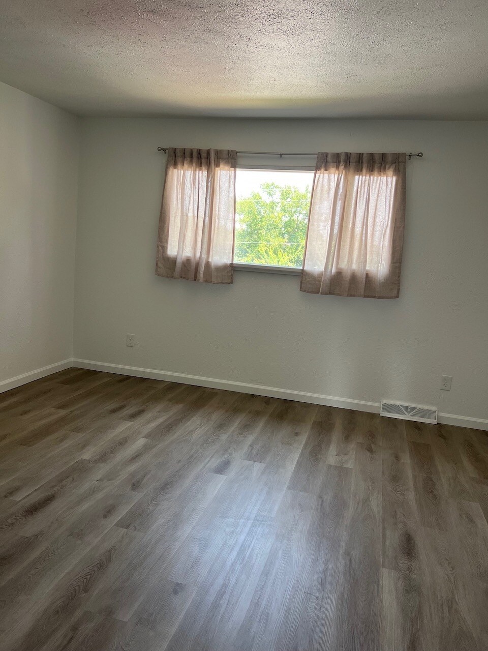 Upstairs primary bedroom, north facing window. - 6396 E Mississippi Ave