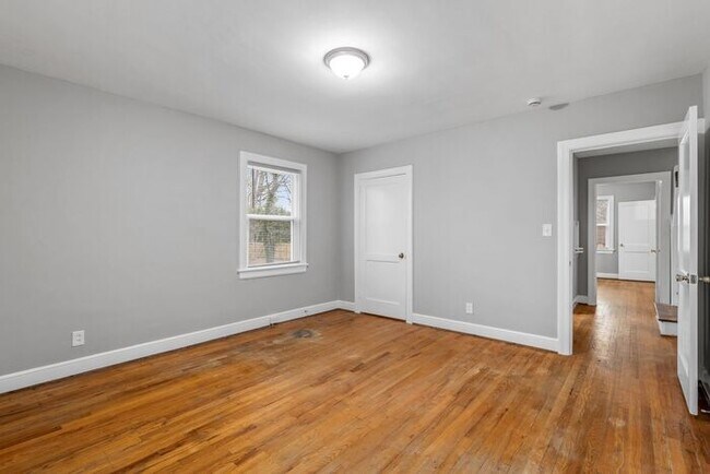 Building Photo - Brick home, Two Story, Hardwoods, DR, 2 Sun Rooms, FP, Carport!.