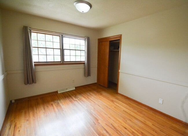 Building Photo - Beautiful multi-level with Gorgeous Yard and LOTS of Storage!