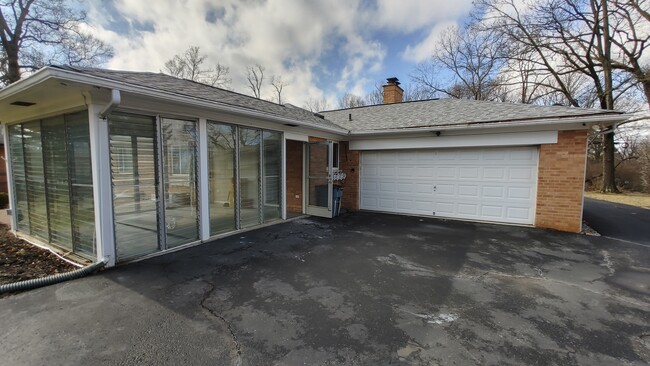 Sunroom and 2 car garage - 6934 Winding Way