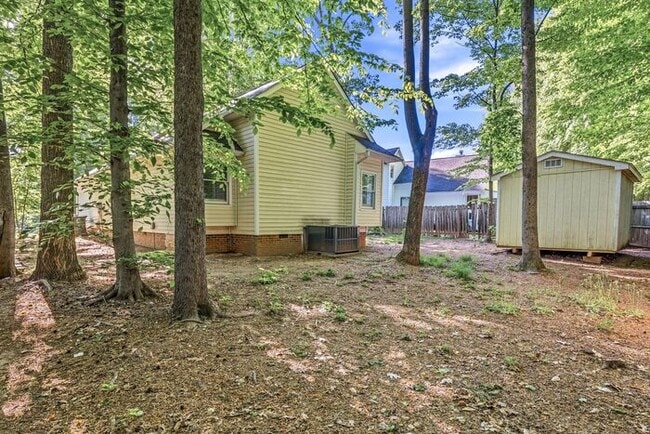 Building Photo - NW - Updated Home with Granite Counter-tops, Fire Place, Deck, Storage Building, Garage!