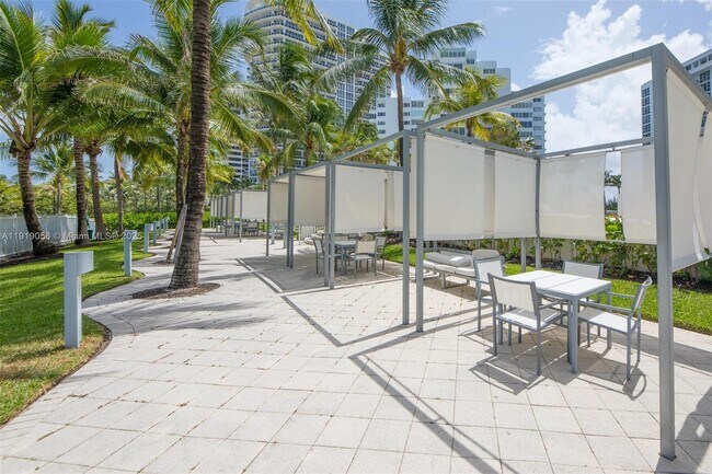 Building Photo - 10275 Collins Ave