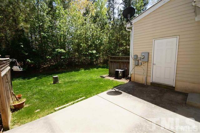 Patio with storage door - 303 W Savannah Ridge Rd