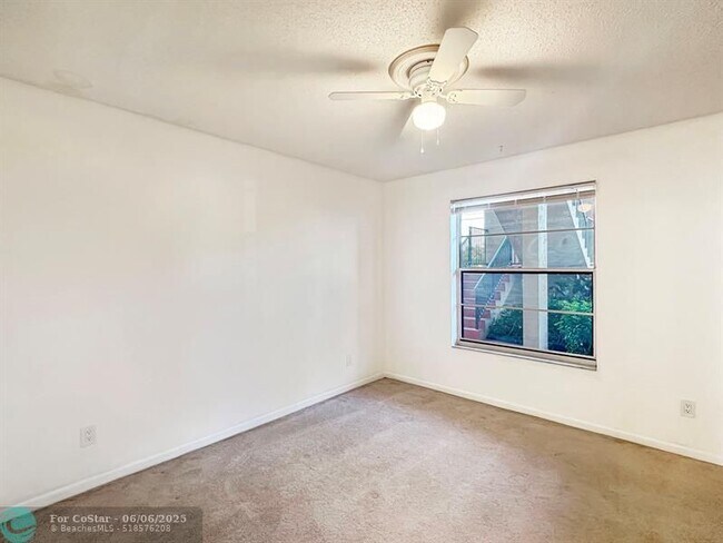 Building Photo - 6090 N Sabal Palm Blvd