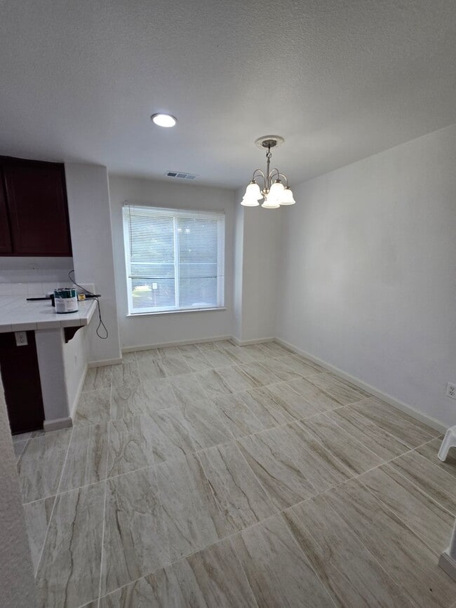 Building Photo - Beautifully Remodeled Tri Story Home located in a Gated Community ...