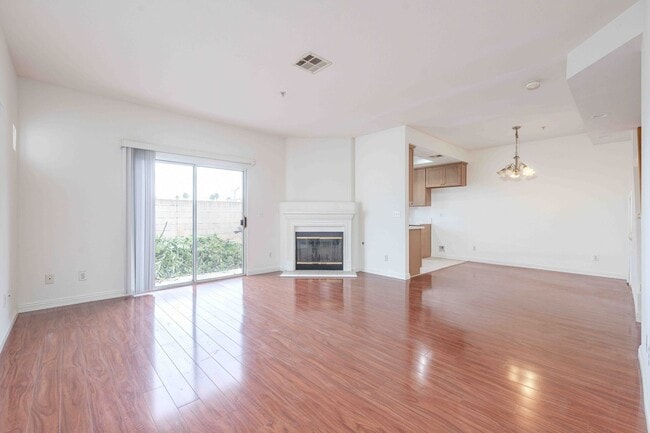 Building Photo - Gated Townhome with Updated Kitchen and Private Backyard