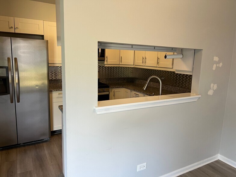 Kitchen from Dining Area - 673 Savannah Ln