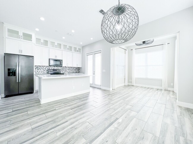 Building Photo - Lake Nona Move-In Special! Save $100/Month | 4 Bed, 3.5 Bath Laureate Park Townhome