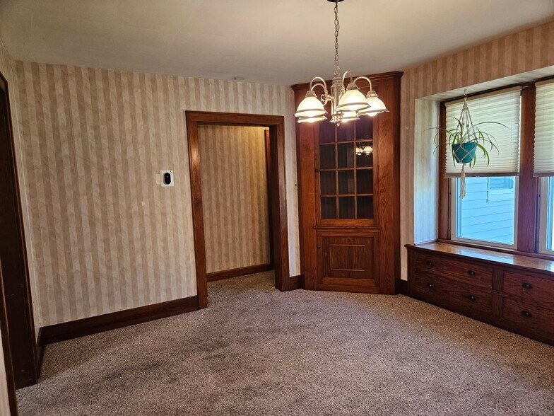 Dining room with built in cabinets and drawers - 4047 Mogadore Rd