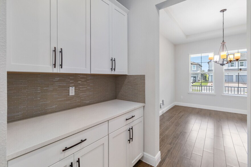 Butler pantry to dining. - 16753 Gullfloss Ter