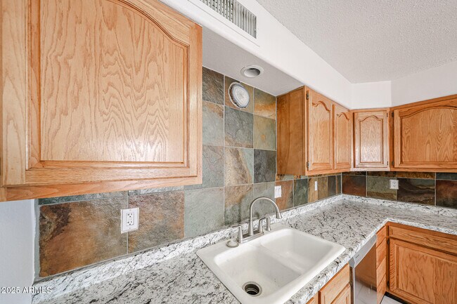 Building Photo - 3408 W Port Au Prince Ln