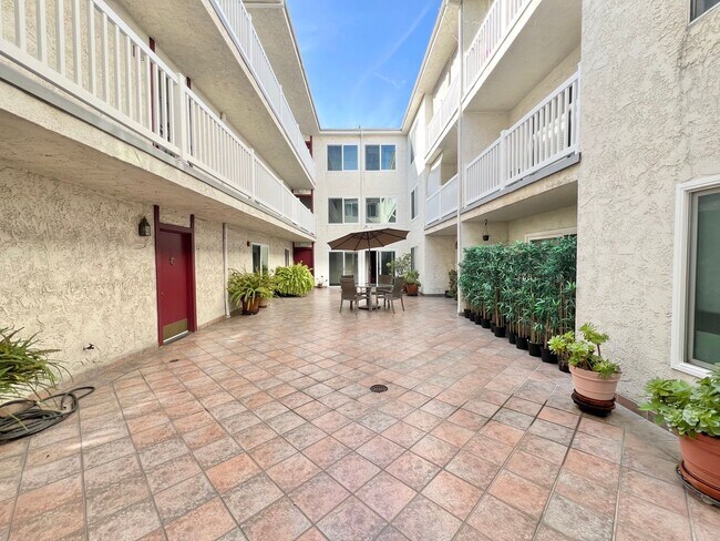 Building Photo - Contemporary 2 Bed Condo with 2 Garage Parking Spaces, Community Pool, and 3 Private Balconies