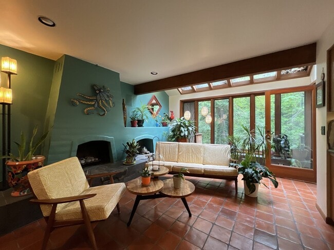 Building Photo - One-of-a-Kind Custom Home with Wall of Windows, Stone Fireplaces, Expansive Entertainment Space &...