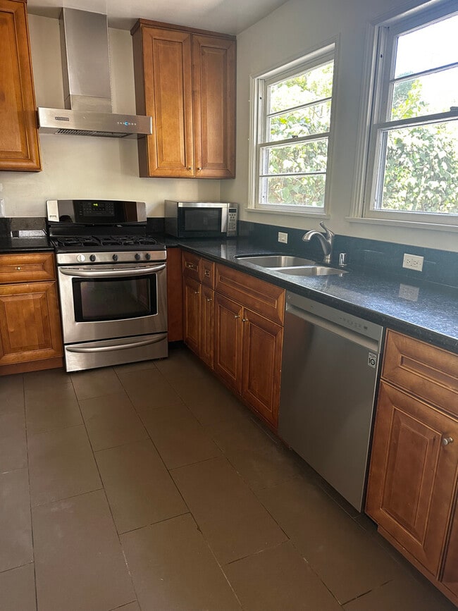 New, updated kitchen with dishwasher, and refrigerator included. - 924 Nowita Pl
