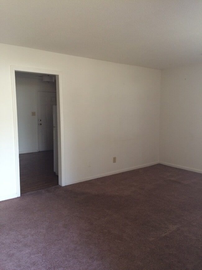 Building Photo - Brick Home with Carport & Fenced yard