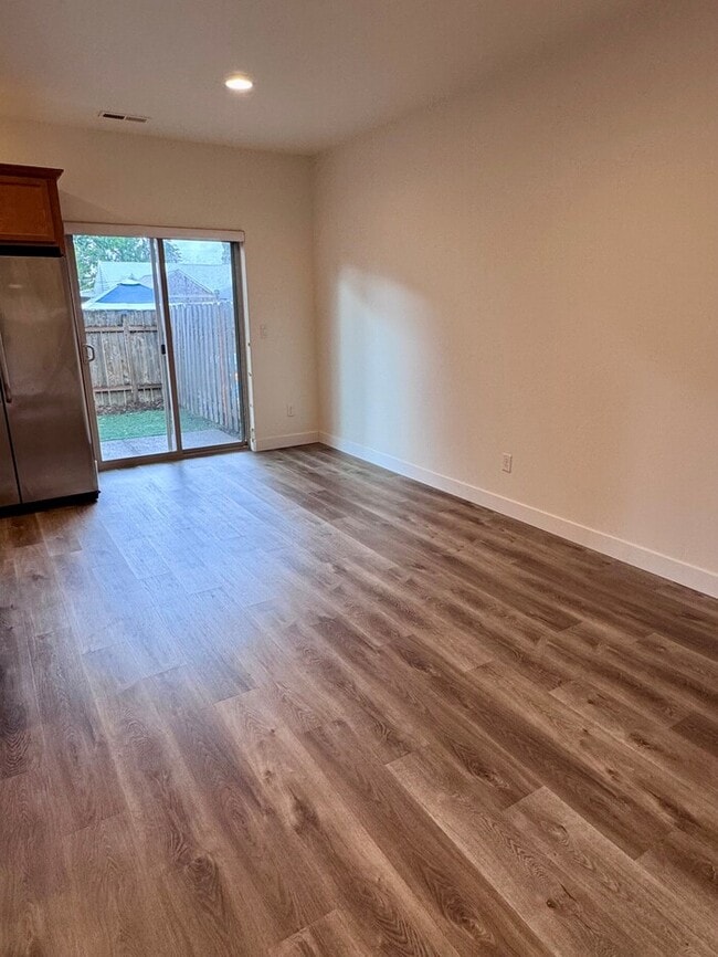 Building Photo - Beautiful Home with LVP Flooring, SS Appliances, Garage, W/D, Fenced Yard, LARGE Master & MORE!