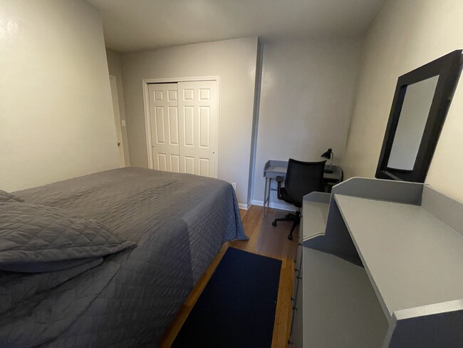 Bedroom 1 has queen size bed, double dresser, book shelf, desk, chair and double closet - 1718 U St NW