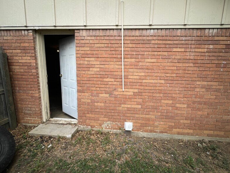 Garage has a side door entrance to the backyard - 2314 Normandy Dr