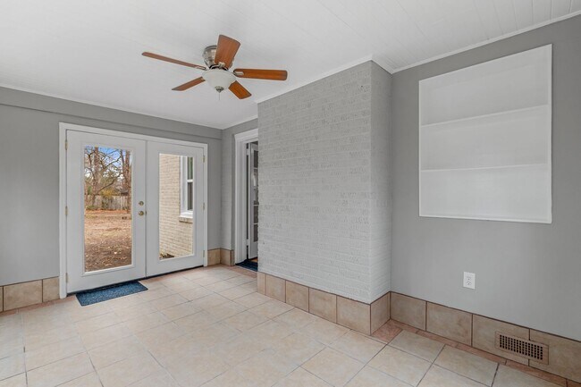 Building Photo - Brick home, Two Story, Hardwoods, DR, 2 Sun Rooms, FP, Carport!.