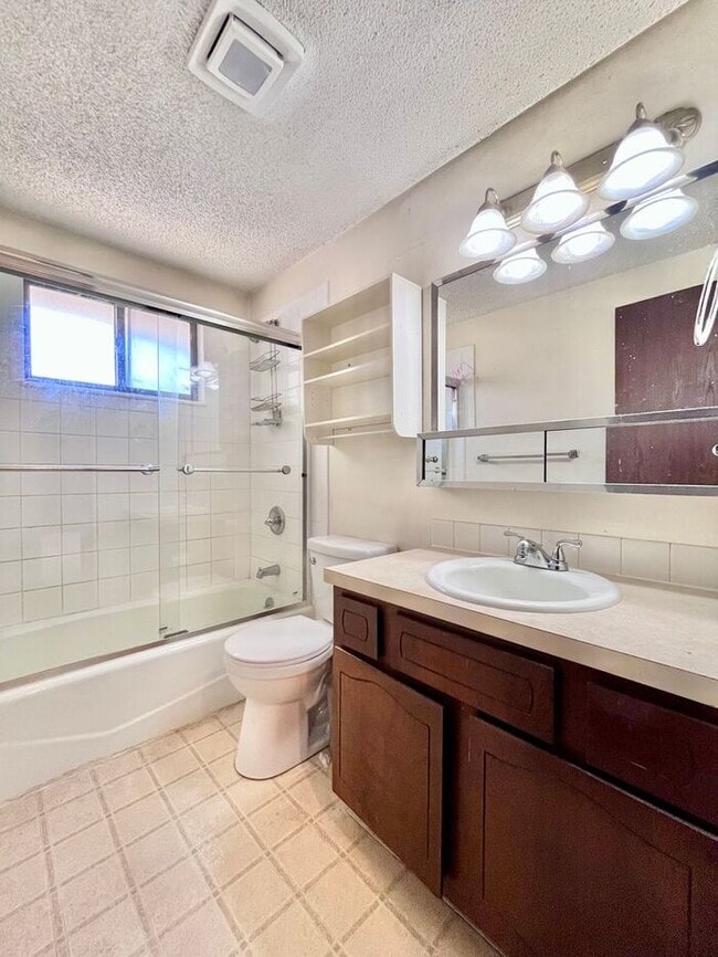 Building Photo - NEW PAINT, FLOORING & APPLIANCES! 2 Bedroo...