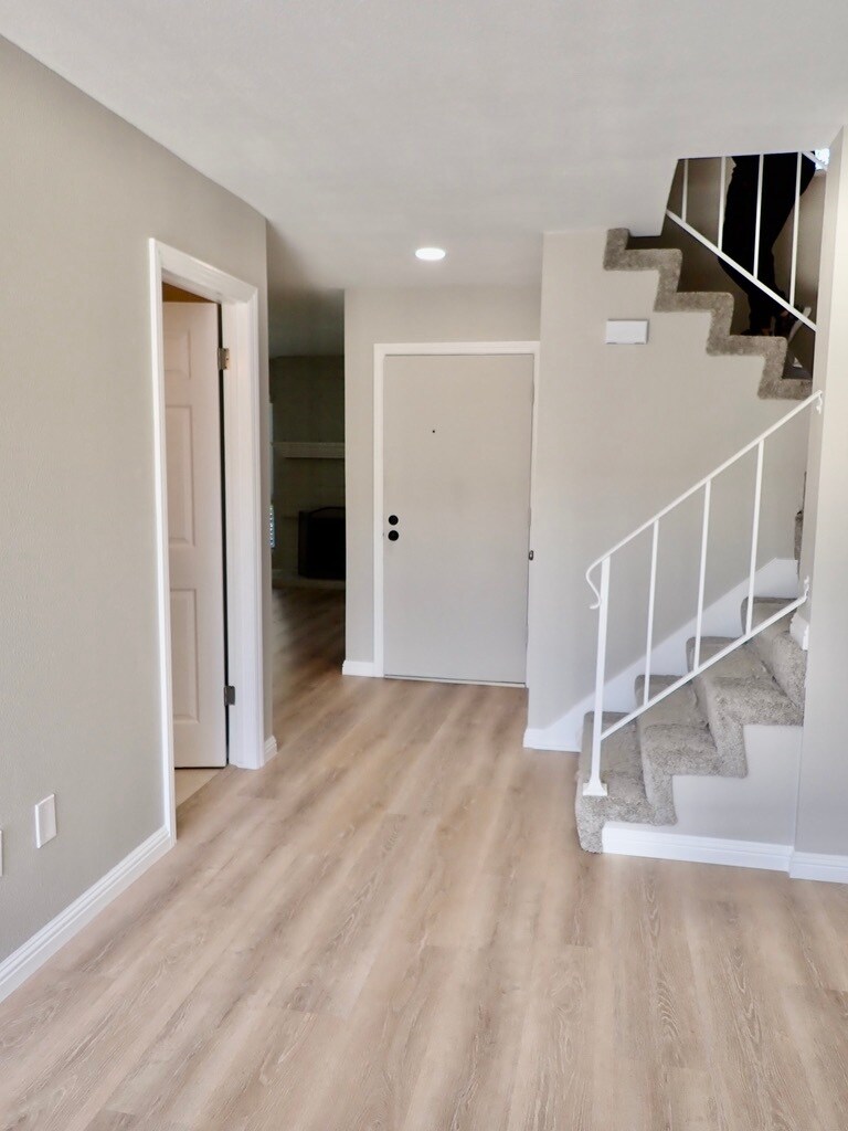 Hallway to stairs and front of home - 11266 Fripps Way