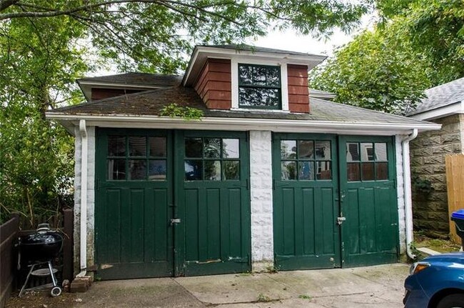 2-car garage. Garage doors have been fully replaced (now brown) and under lock and key. - 259 Doyle Avenue