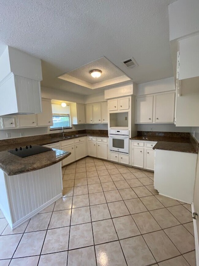 Building Photo - Come and view this open floor plan with much potential. Formal and dining room, granite counters,...