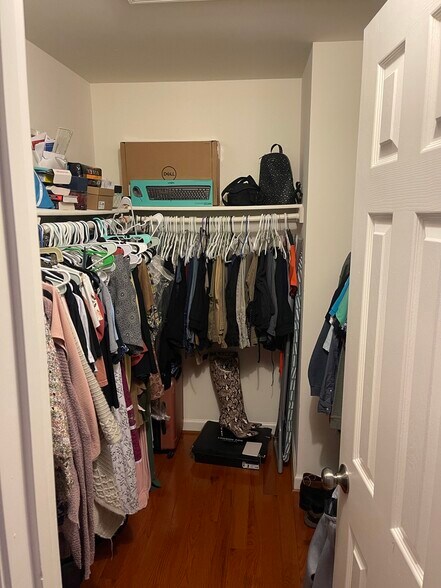 Primary Bedroom Walk-in Closet - 2100 Bobbyber Dr