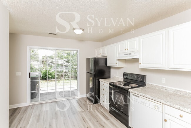 Building Photo - Welcome to this beautiful and sun-filled 3...