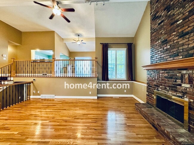 Building Photo - A Lovely Lenexa Home w/ Wood Floors Throughout, Updated Kitchen, Finished Basement and a Fenced Y...