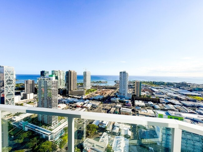 Building Photo - Furnished Symphony Condo with Direct Ocean Views and Two Parking