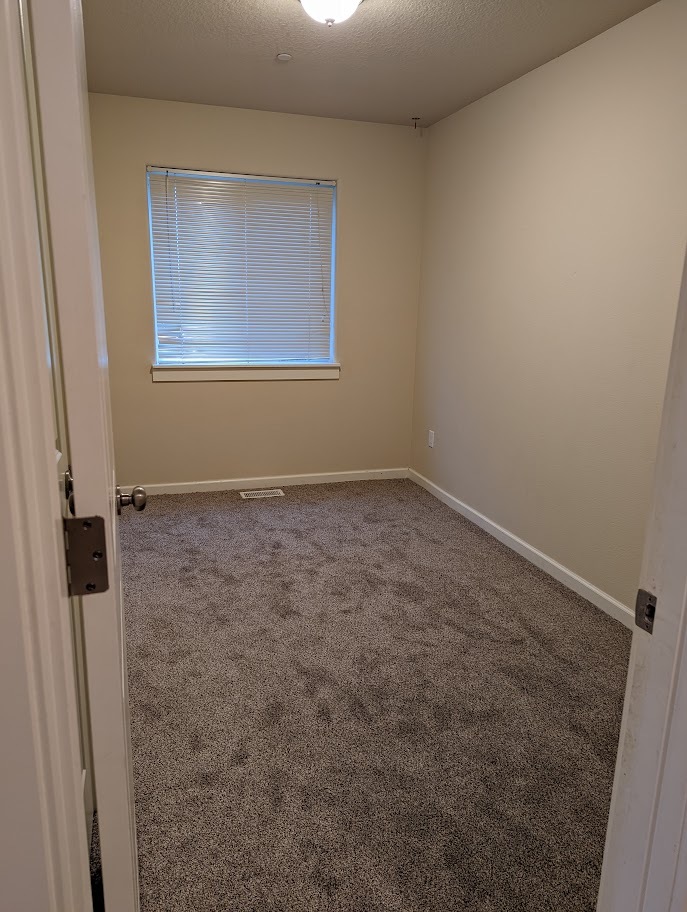 Smaller bedroom by dining room - 713 E Main St