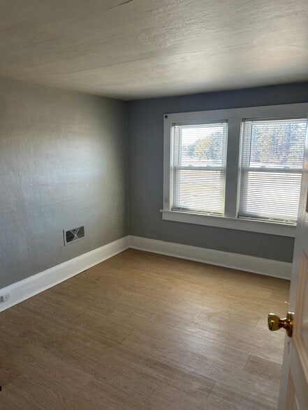 Bedroom with electric fireplace - 701 S DuPont Blvd