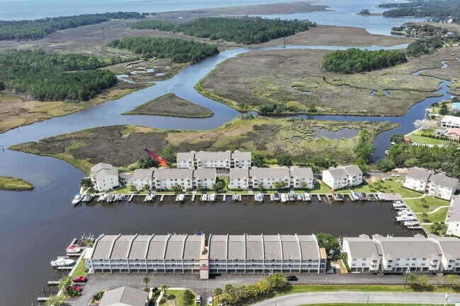 Building Photo - WATERFRONT LIVING! BEAUTIFULLY APPOINTED CONDO ON THE BAYOU IN OS SCHOOL DIST - FULLY FURNISHED