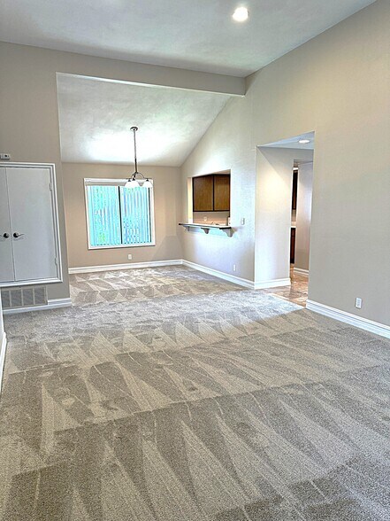 Living room extends into the dining room area. - 545 S Ranch View Cir