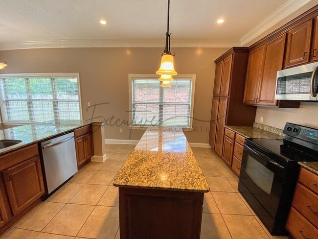 Building Photo - Family Home in Lafitte Landing – Fenced Ya...