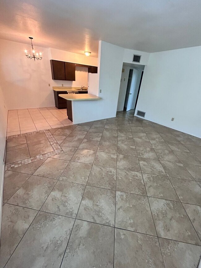 Building Photo - 2 bedroom 1 bath unit with laundry room, enclosed yard and carport.