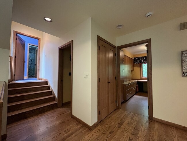 Building Photo - One-of-a-Kind Custom Home with Wall of Windows, Stone Fireplaces, Expansive Entertainment Space &...