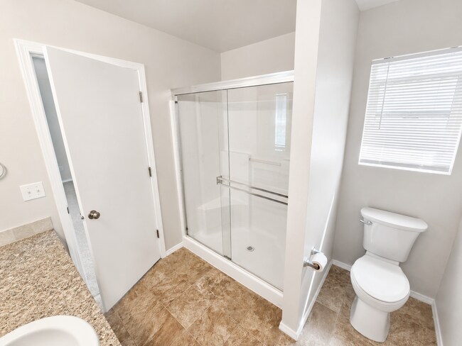 Building Photo - Easy-Living 3 Bed, 2 Bath Home with Double Garage, Pool Access & Private Courtyard