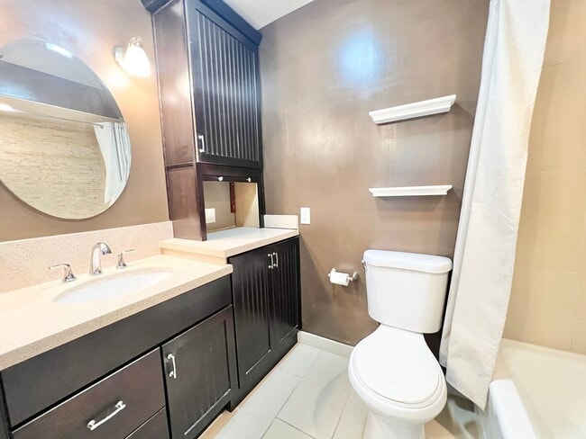 Building Photo - Contemporary 2 Bed Condo with 2 Garage Parking Spaces, Community Pool, and 3 Private Balconies