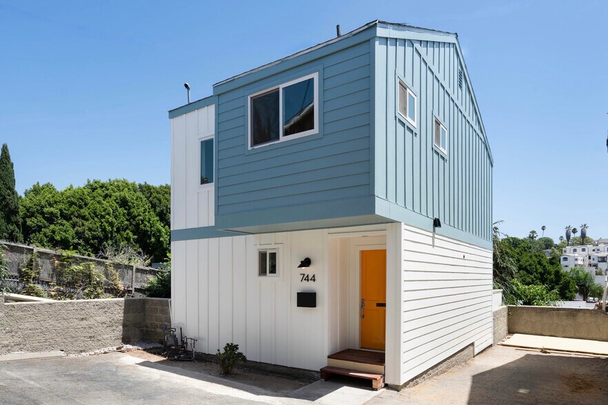 Exterior of townhouse. Two tandem parking spaces pictured on right side of photo. - 744 N Dillon St