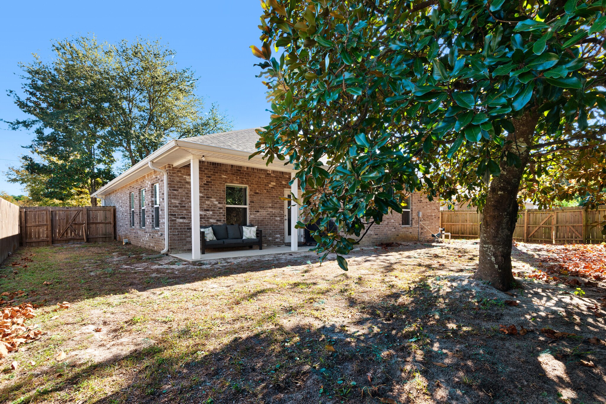 Backyard has a private fence, patio furniture, and barbecue - 28 Snook Rd