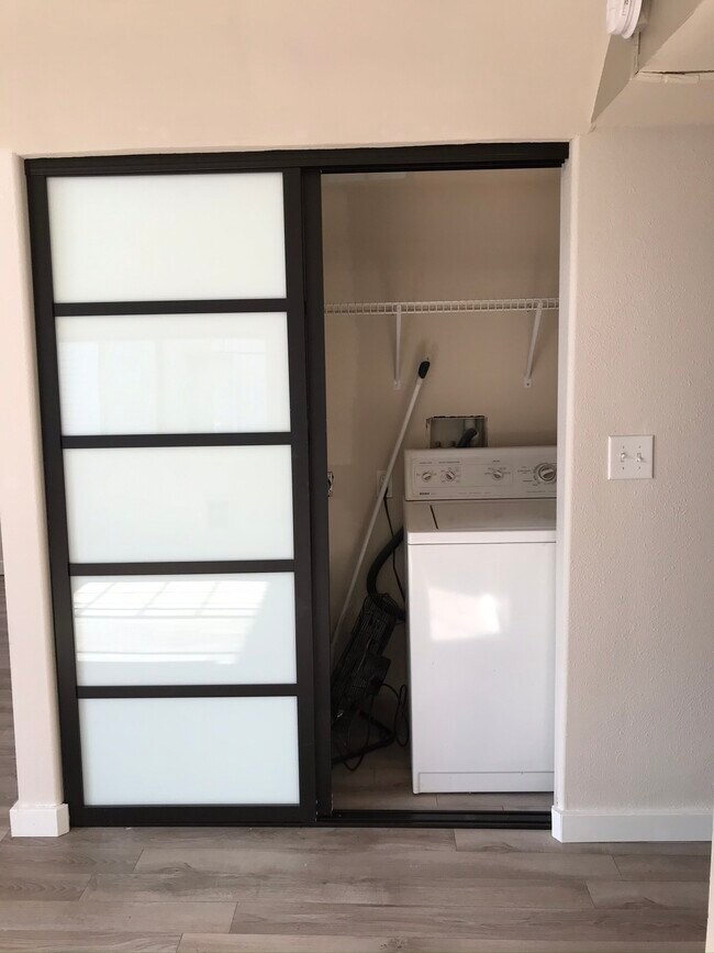 Laundry room with shoji sliding doors - 916 Martin Luther King Jr Way S.