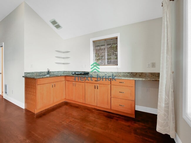 Building Photo - Studio for Rent with Garage Parking!