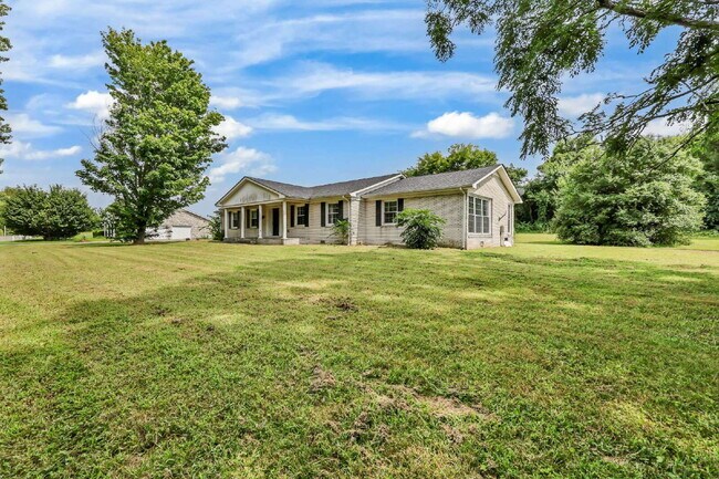 Building Photo - spacious 4-bedroom, 2.5-bath home featuring a 2-car garage and fresh updates throughout.