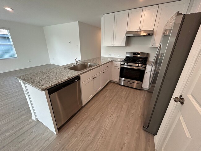 Building Photo - *MOVE IN SPECIAL* Modern 4-Bedroom Living with Community Pool Access!