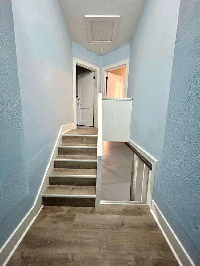 New luxury vinyl flooring installed in common space. - 6516 Oleatha Ave