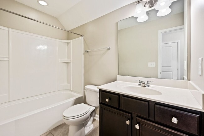 Building Photo - AVAILABLE IN MAY!  Stunning, like-new 4 bedroom, 4 bath home with large fenced yard!